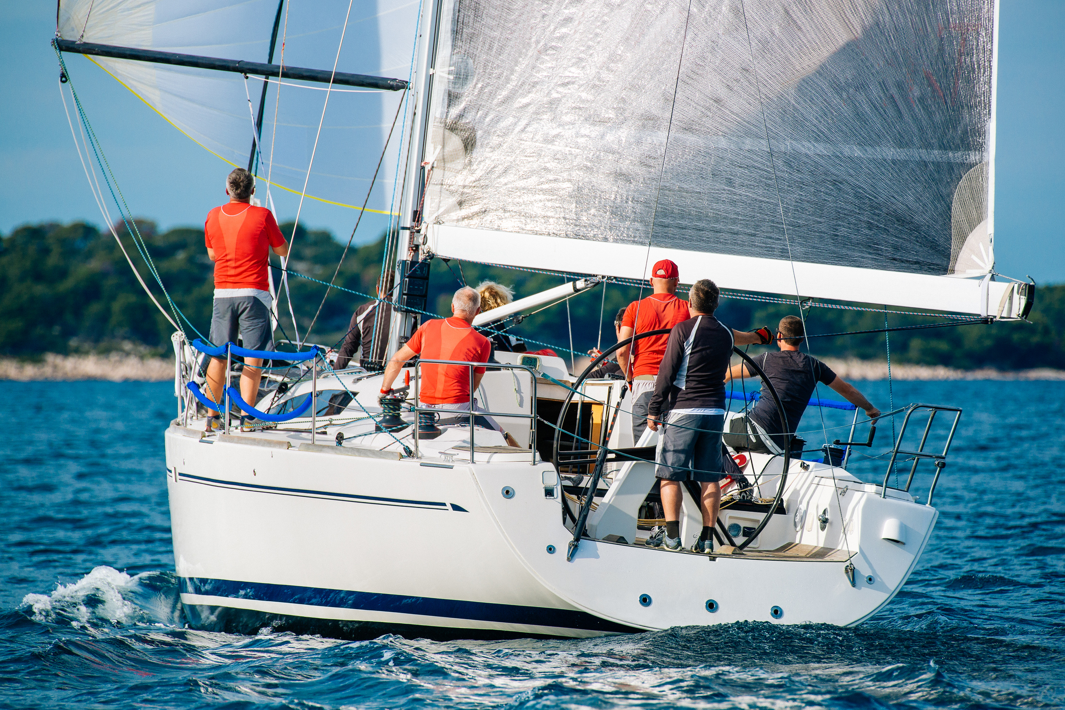 Sailing crew on sailboat on regatta