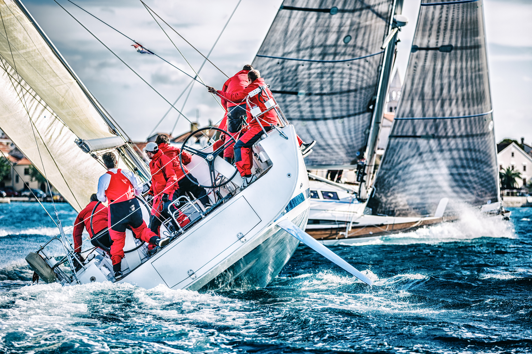 Sailing crew on sailboat during regatta